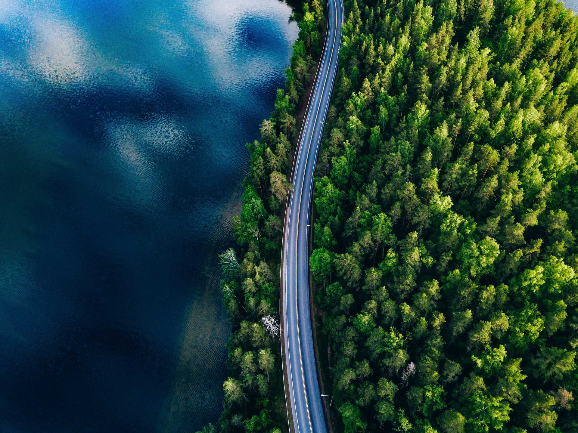 Long street with lake and forest